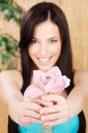 Happy Woman Holding Orchid Stock Photo