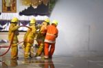 Fireman. Firefighters Fighting Fire During Training Stock Photo