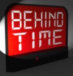 Behind Time Digital Clock Shows Running Late Or Overdue Stock Photo