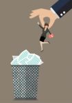 Boss Throws A Business Woman In The Trash Can Stock Photo