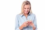 Young Charismatic Woman Using Smartphone Stock Photo