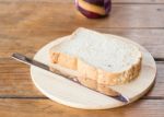 Whole Grain Bread On Wooden Plate Stock Photo