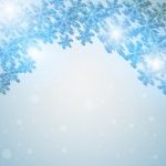 Winter Blue Sky With Falling Snow Stock Photo