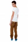 Trendy Young Boy Turning Back Stock Photo