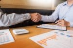 Two Confident Business Man Shaking Hands During A Meeting In The Stock Photo
