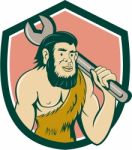 Neanderthal Caveman With Spanner Crest Cartoon Stock Photo