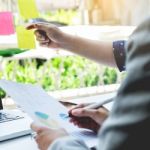 Business Discussing Documents And Ideas At Meeting Stock Photo