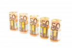 Rolls Of Euro Notes In Row On White Stock Photo