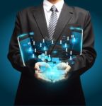 Technology In The Hands Of Businessmen Stock Photo