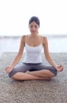 Beautiful Young Woman Doing Yoga Exercises At Home Stock Photo