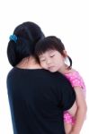 Lovely Asian Girl Sleeping On Mom's Shoulder, Over White Background Stock Photo