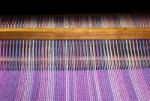 Detail Of Fabric In Comb Loom With Ultraviolet And Lilac Colors Stock Photo