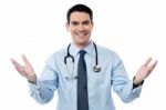 Smart Doctor Standing With Arms Wide Open Stock Photo