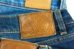 Leather Label On Blue Jeans Stock Photo