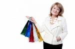 Senior Woman With Shopping Bags Stock Photo