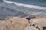 Ocean Waves From Stone Pier Stock Photo