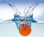 Basketball In Water Stock Photo