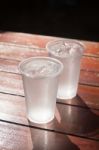 Glass Of Water On Wooden Table Stock Photo