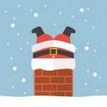 Santa Claus Stuck In The Chimney Stock Photo