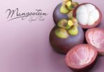 Mangosteen On Purple Solid Background Stock Photo