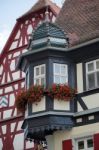 Red Geraniums On A House In Rothenburg Stock Photo