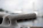 Mooring Bollard With Boats In The Background Stock Photo
