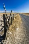 Long Asphalt Road On Vast Dry Land Stock Photo