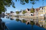 View Along A Canal In Bruges West Flanders In Belgium Stock Photo