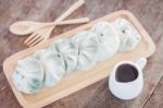 Chinese Leek Steamed Dessert On Wooden Table Stock Photo