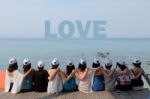 Women Friends Sit Hug Together Look Love Blue Sea Sky Stock Photo