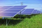 Solar Panels On Green Grass Stock Photo