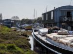 Faversham, Kent/uk - March 29 : Assorted Boats Moored In A Creek Stock Photo