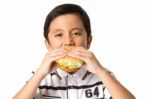 Boy Eating A Burger Stock Photo