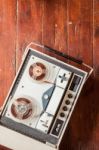 Old Tape Recorder On Wooden Background Stock Photo