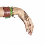 Mehendi Or Henna Tatoo On The Female Hands In Bracelets Isolated Stock Photo