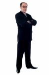 Businessman With Crossed Arms Stock Photo