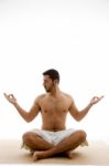 Man In Yoga Pose Stock Photo