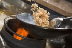 Stir fried rice being cooked in wok Stock Photo