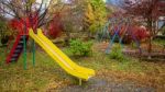 Kid Outdoor Playground With Autumn Color Stock Photo