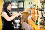 Combing Customer's Hair Stock Photo