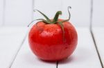 Tasty Tomato On A White Background Stock Photo
