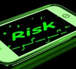 Risk On Smartphone Shows Unstable Situation Stock Photo