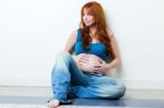 Beautiful Pregnant Woman Relaxing At Home Stock Photo