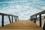 Wooden Stairs Or Path To The Bright Ocean Stock Photo