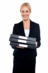 Female Executive Carrying Business Files Stock Photo