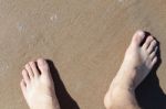 Leg On Sea Sand Stock Photo