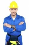 Young Worker With Arms Crossed Stock Photo