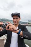 Young Man With Irish Beret Taking A Photo Stock Photo