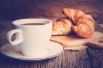 Continental Breakfast With Coffee And Croissant Stock Photo