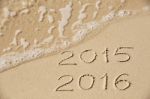 2015 2016 Inscription Written In The Wet Yellow Beach Sand Being Stock Photo